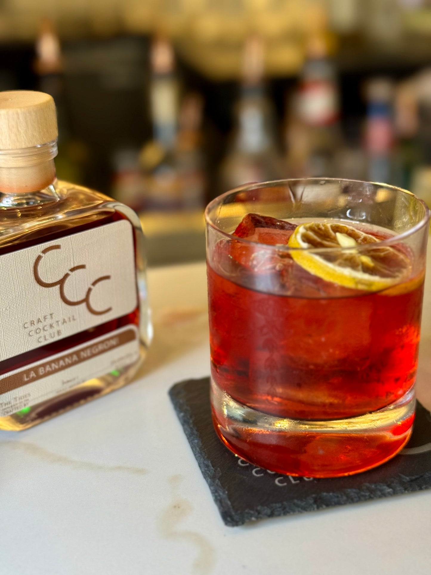 picture of a Negroni from craft cocktail club at a bar 